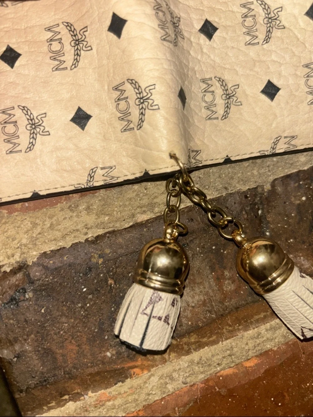 MCM Beige Monogram Tassel Compact Wallet